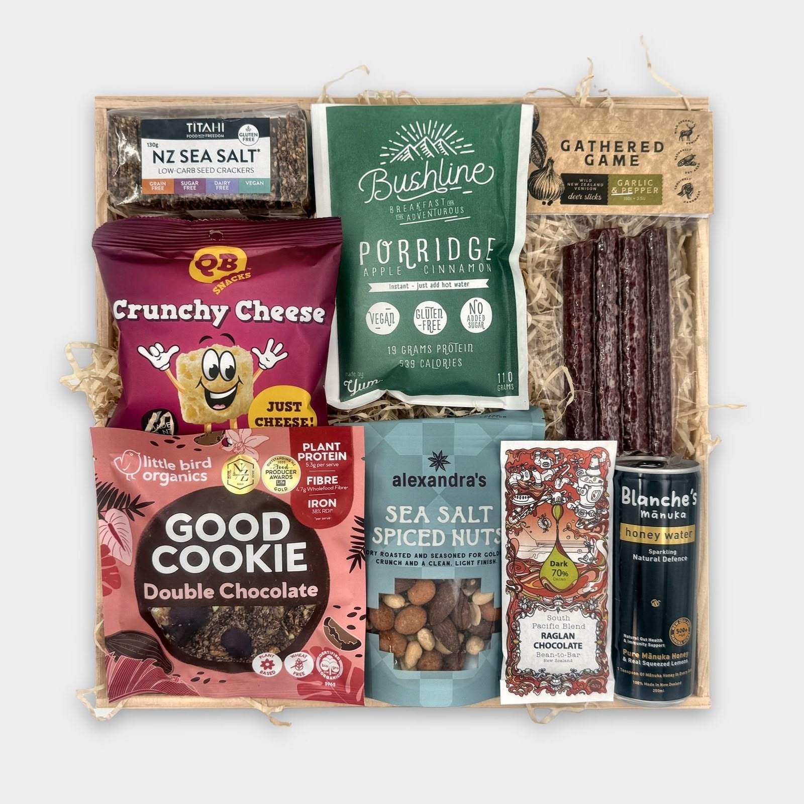 Adventure Awaits Care Package with Titahi sea salt crackers, QB Crunchy Cheese, Bushline porridge, Gathered Game deer sticks, a Good Cookie, Alexandra's nuts, Raglan Chocolate and Blanche's honey water